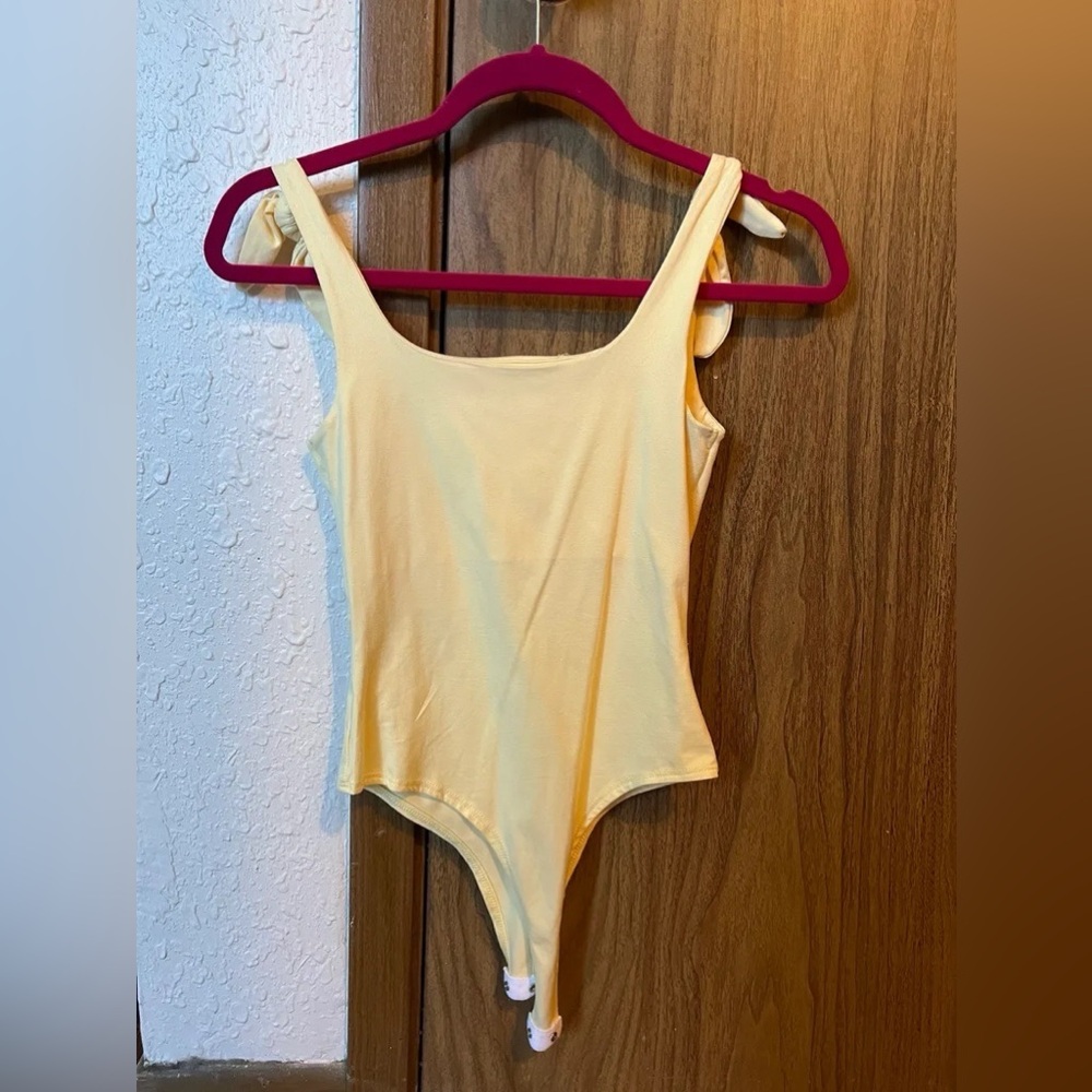 yellow bodysuit